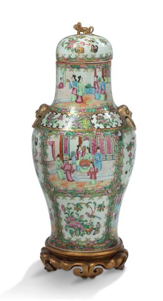 CHINE 
A Canton porcelain and Famille Rose enamel covered vase decorated with animated...