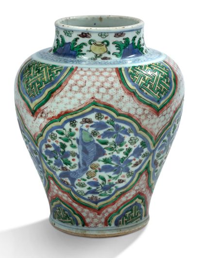 CHINE 
A porcelain and enamel baluster jar of the green family, decorated with lotiform...