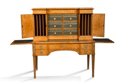 null FLAT DESK AND ITS CARTONNIER in burr amboyna veneer and chased and gilded bronzes....