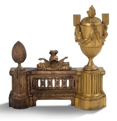 null Pair of chased and gilt bronze CHENETS decorated with antique flamed urns, trophies...