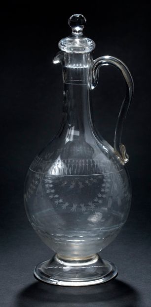 null Blown glass decanter with cut and engraved decoration with the wheel of garlands,...