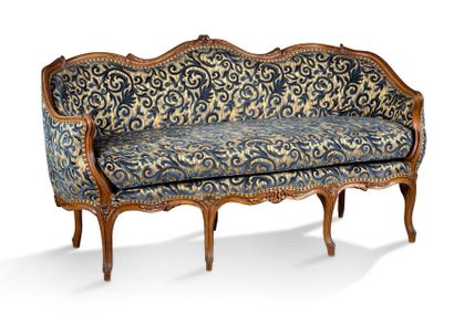 null BODY SOFA in natural wood carved with leaves and flowers. Backrest with sinuous...