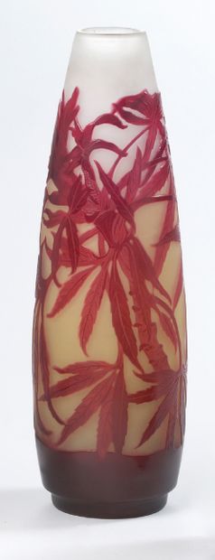 ÉTABLISSEMENTS GALLÉ A multilayered glass vase with engraved flower and exotic leaves...