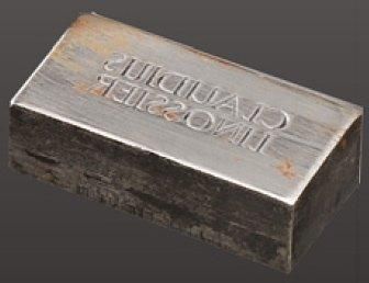 null Tampon d'estampille en métal de Claudius Linossier. Vers 1920-1930. L: 4 cm...