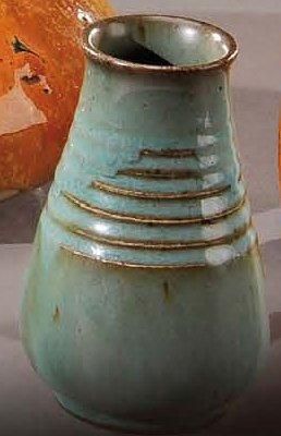 AUGUSTE DELAHERCHE (1857-1940) Vase en grés à corps ovoïde et col évasé émaillé vert...