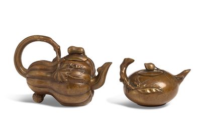 null China, 20th century

Two bronze pourers, one in the shape of a pumpkin, the...