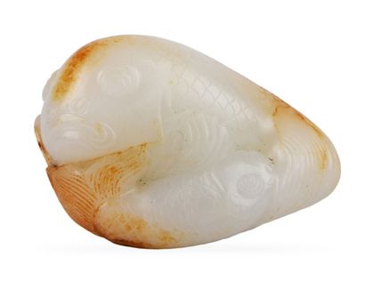 CHINE XXe siècle 


White jade representing two carps on a lotus flower, a large...