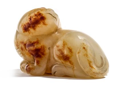 Chine XIXe siècle 


Rust-veined jade statuette representing a reclining tiger, its...