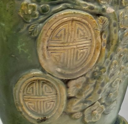 VIETNAM XXe siècle 
A small olive-green enamelled stoneware vase with a flared neck,...