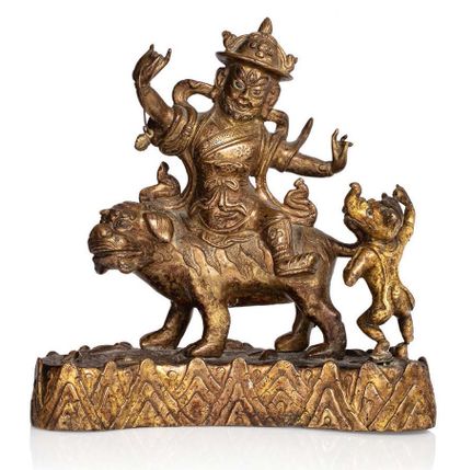 TIBET XVIIE - XVIIIE SIÈCLE 
Groupe en bronze doré, représentant

Pehar sur le lion...