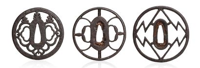 JAPON XVIIE - XVIIIE SIÈCLE Three iron sukashi tsuba, one decorated with stylized...