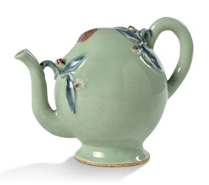 CHINE XVIIIE - XIXE SIÈCLE 
A porcelain and celadon enamel jug in the shape of a...