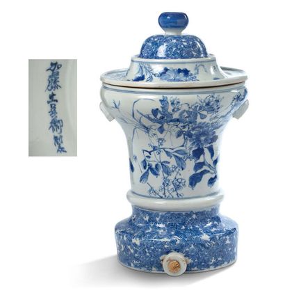 JAPON XXE SIECLE Large covered blue-white porcelain pot with flowers and calligraphy.
H....