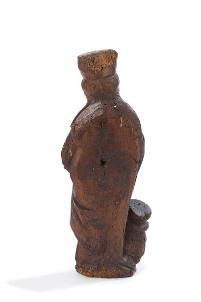 null SAINT BARBE in carved walnut. Standing with her head crowned, she carries a...
