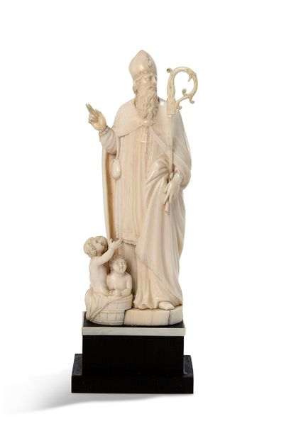 null SAINT NICOLAS in ivory carved in the round, at his feet the three young children...