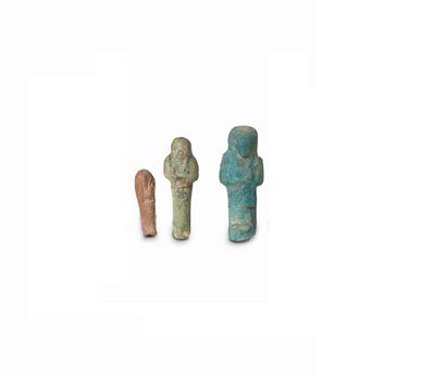 Collection Raoul Lacour (1845-1870) THREE OUSHEBTIS Blue-glazed earthenware for one.
Late...