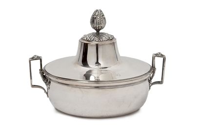 null A silver COUVERED VEGETABLE with double handles.
The one engraved with a monogram...