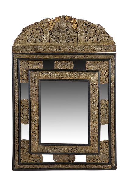 null Blackened wood and copper mirror with a pediment decorated with a bird surmounting...