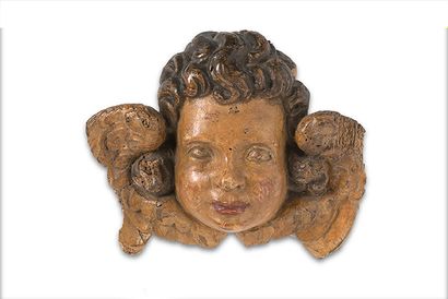  + TWO ANGELOTS' HEADS in carved wood, polychromed...