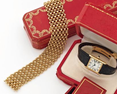 CARTIER Large bracelet articulé en or jaune tressé Signé Cartier et numéroté. Dans...