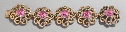 GRES Bracelet orné de cinq motifs à entrelacs et pierre de synthèse rose au centre...