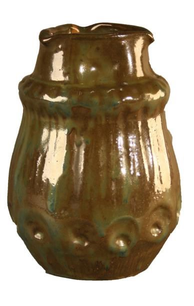 JEAN LANGLADE (1879-1928) Vase ovoîde en grés à émail marron nuancé vert et bleu...