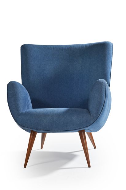 CARLO HAUNER ET MARTIN EISLER A large - backrest armchair covered with “blue jean”...