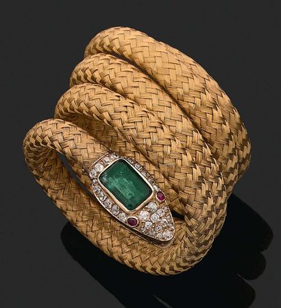 null 
SNAKE" BRACELET 

Emerald, old cut diamonds, cabochon rubies 

Braided gold...