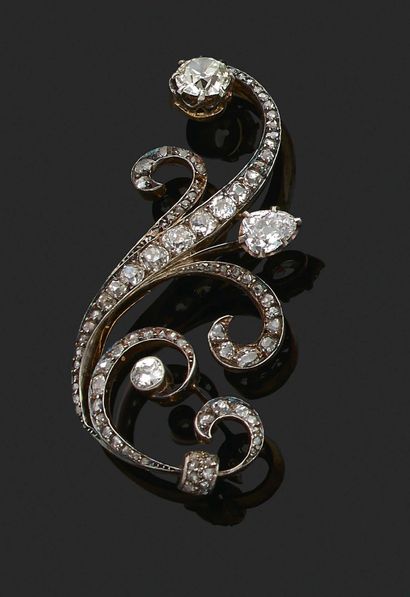 BROCHE « VOLUTES » Diamants tailles ancienne...