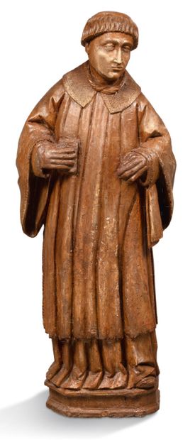 null SAINT DIACRE in walnut carved in the round. Standing, he holds a closed book...