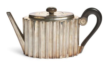 null COLUMN TEAPOT The oval body in the shape of shaft of fluted column. Handle in...