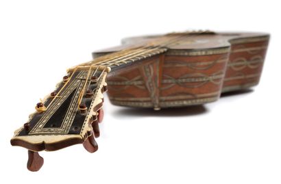 null A TRIANON GUITAR Rare guitar called "en bâteau", the body in fruitwood decorated...