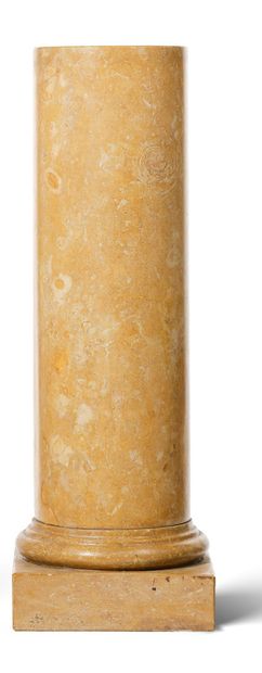 null PAIR OF COLUMNS in solid yellow Sienna marble, the circular shaft resting on...