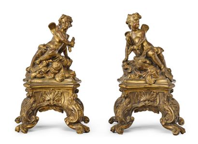 null PAIR OF CHENETS in chased and gilded bronze with mercury representing putti...