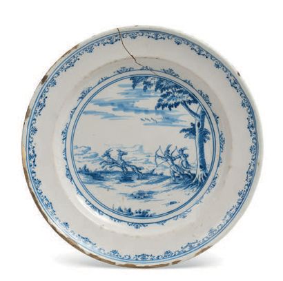 MOUSTIERS, ATELIER CLÉRISSY Earthenware plate with blue monochrome decoration of...