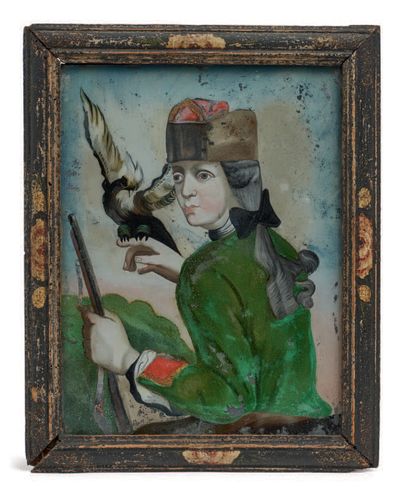 玻璃下的猎人画像，他穿着绿色的衣服，红色的面孔，戴着猫头鹰和帽子。他的右手拿着一只猎物，左手拿着一把步枪。洛林，18世纪。
高度：24.5厘米...