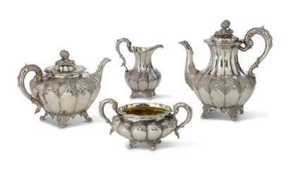 TEA AND COFFEE SERVICE composed of a teapot,...