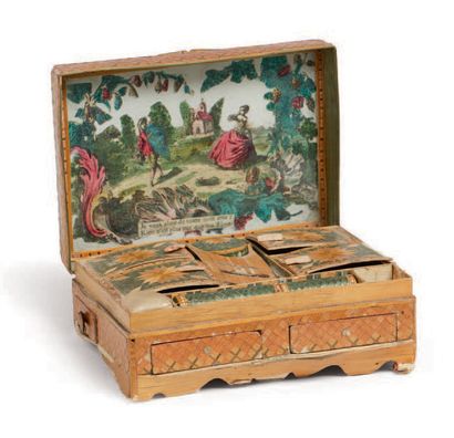 null SMALL COUTURE BOX in straw marquetry decorated with crosses. The lid with a...
