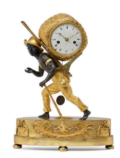 null A gilt bronze and black patinated clock showing a cotton ball carrier after...
