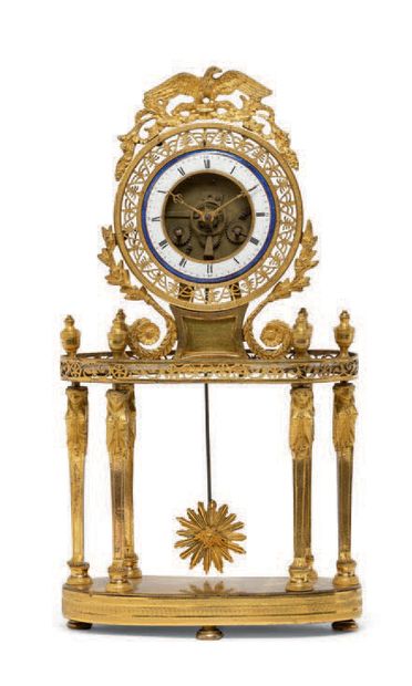 null PORTICAL CLOCK "SQUELETTE" in chased and gilded bronze, the circular dial with...