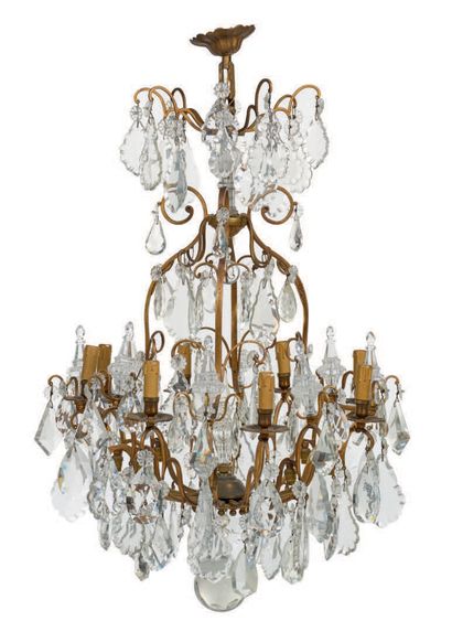 null CAGE LIGHT in metal and cut glass, it offers eight arms of light. Numerous pendants...