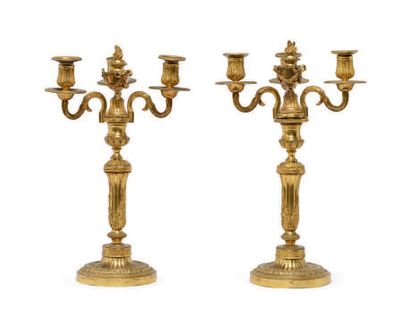 PAIR OF CANDELABRES in chased and gilded...