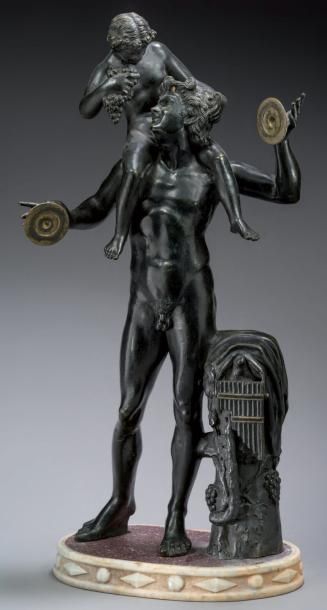 null Statuette en bronze ciselé et patiné, partiellement doré, figurant un satyre...