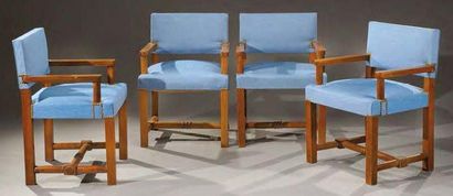 Paul DUPRE-LAFON (1900-1971) Rare suite de quatre fauteuils en noyer blond teinté...