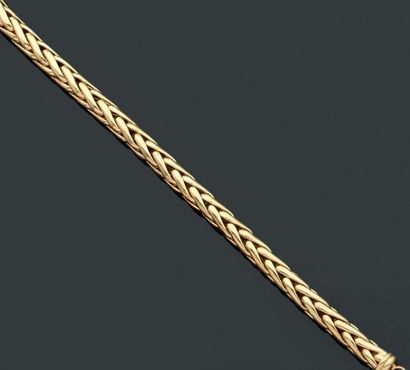 null Bracelet articulé en or jaune tressé, maille palmier. Poids brut: 18.4 gr
