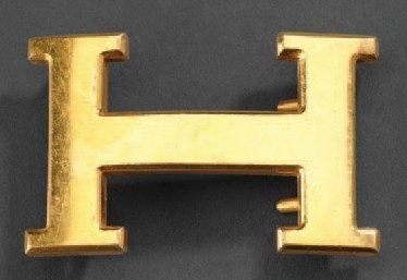 HERMES Ceinturon doré décor d'une mini ceinture