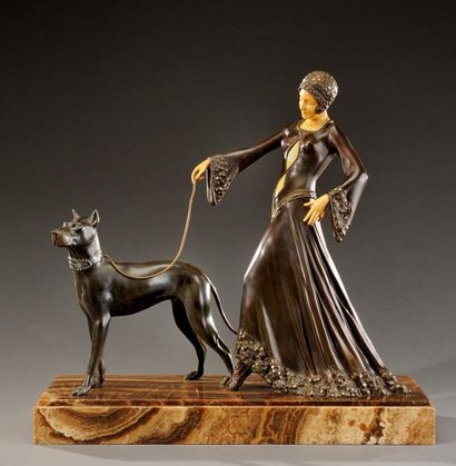 GEORGES GORI (XIX-XXème) Epreuve en régule à patine noire et dorée figurant une femme...