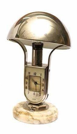 MOFEM Vers 1940 Pendule réveil abat jour en métal chromé. Cadran en verre sérigraphie,...