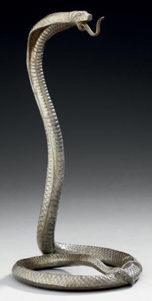 Dans le goût de E. BRANDT Porte montre figurant un serpent à sonnette en métal. Haut.:...