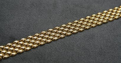 Bracelet en or jaune articulé. poids: 23...